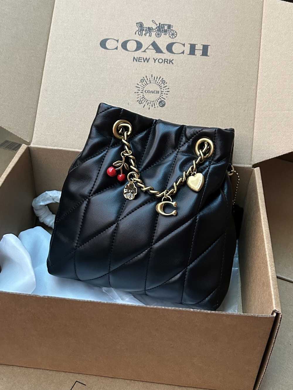 Coach Black Quilted Leather Mini Bucket Bag With Cherry Decorations